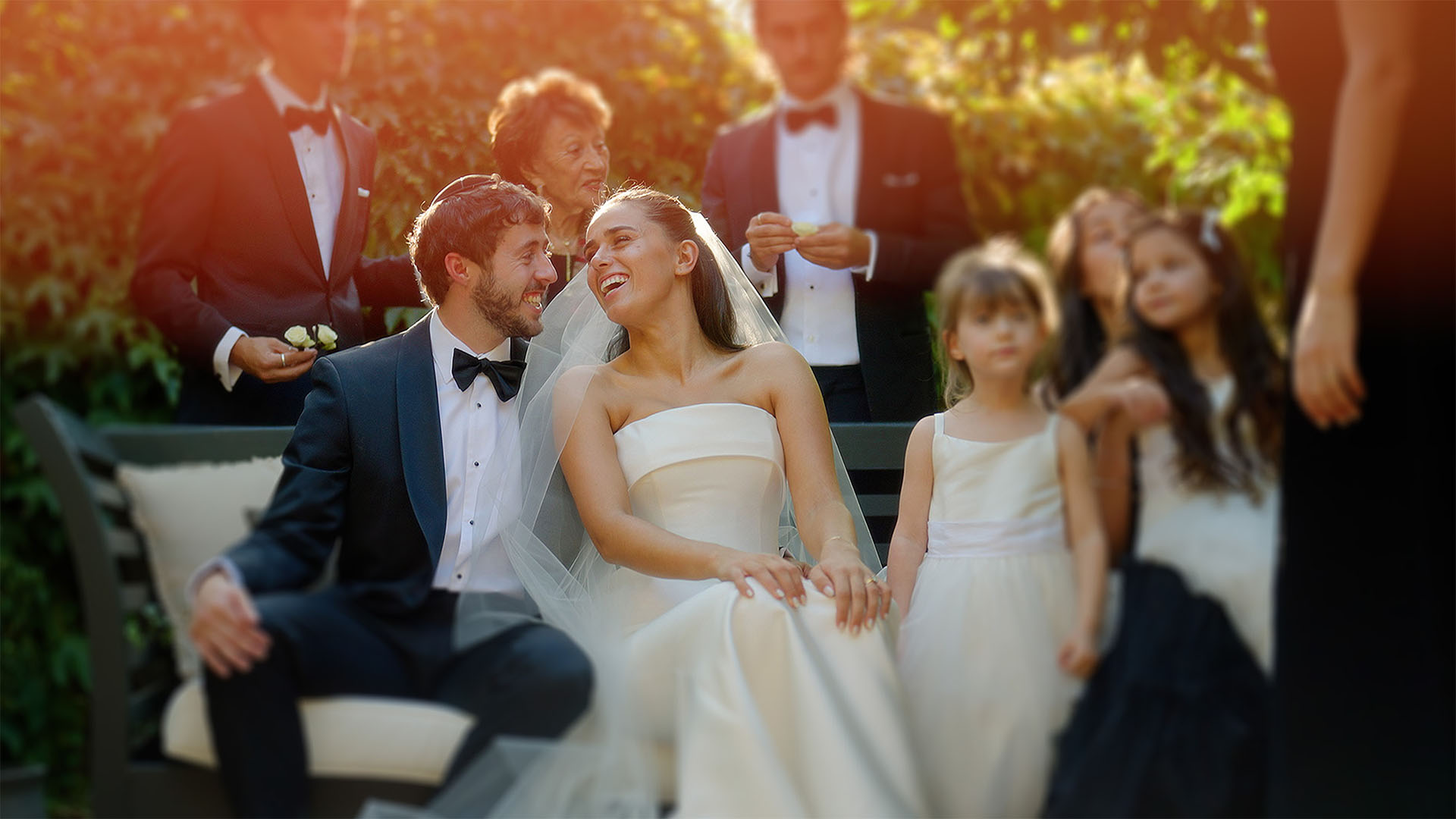 bride and groom sharing a moment during family photoshoot